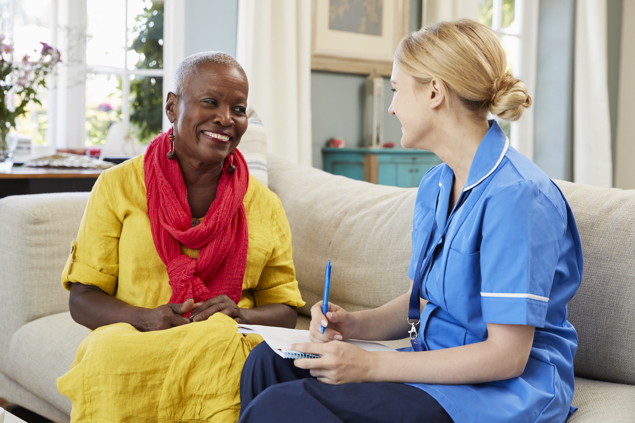 Female Nurse Interviews Woman for Care role